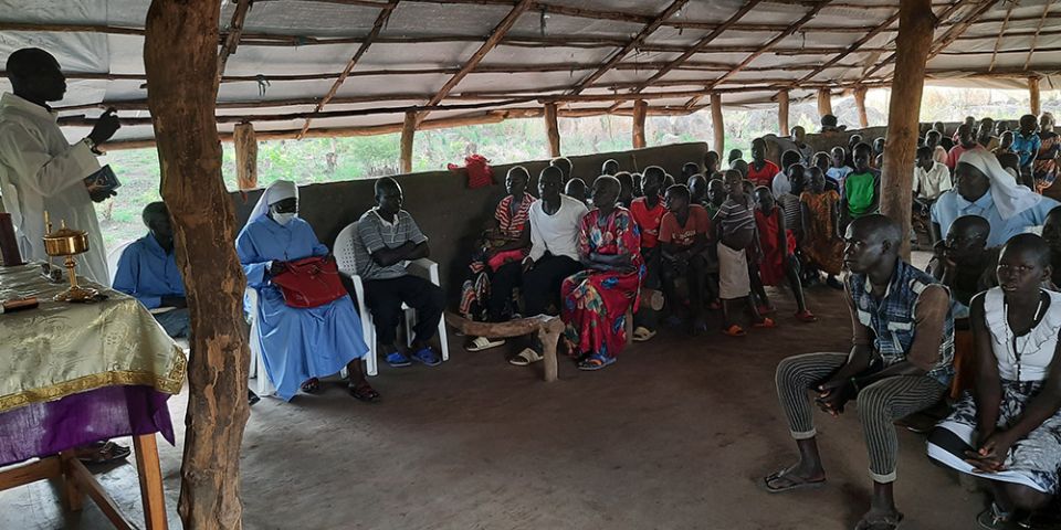 Mwaka Charles, a catechist, leads an Easter service in the absence of a priest in April 2021. (Courtesy of Lazar Arasu) Mwaka Charles, a catechist, leads an Easter service in the absence of a priest in April 2021. (Courtesy of Lazar Arasu)