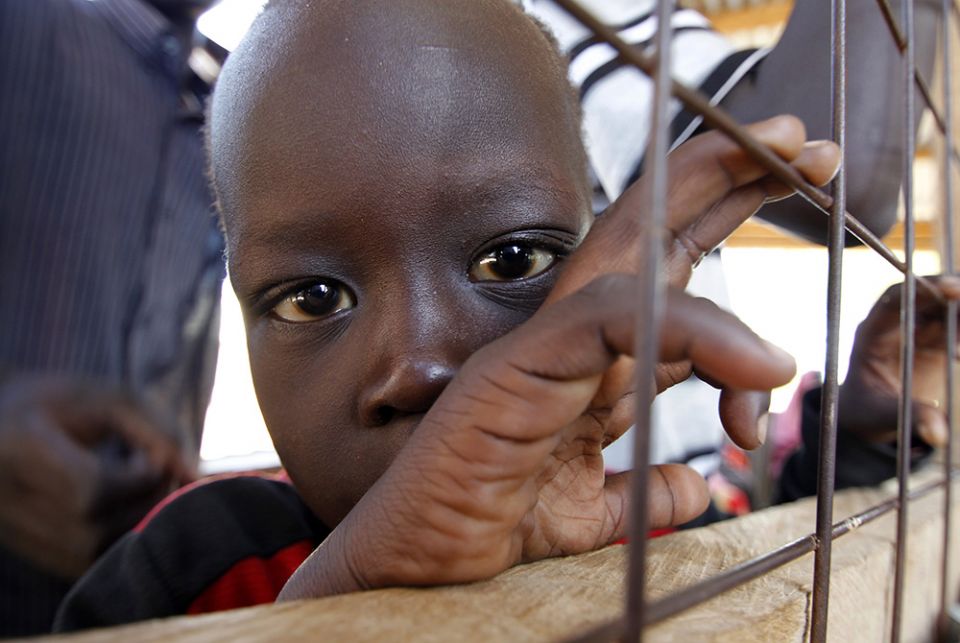 A child from South Sudan is pictured in a 2012 photo at a registration center in the Kakuma refugee camp in northern Kenya. Catholic bishops in Kenya are urging the government to shelve plans to close two refugee camps that host refugees who fled civil wa