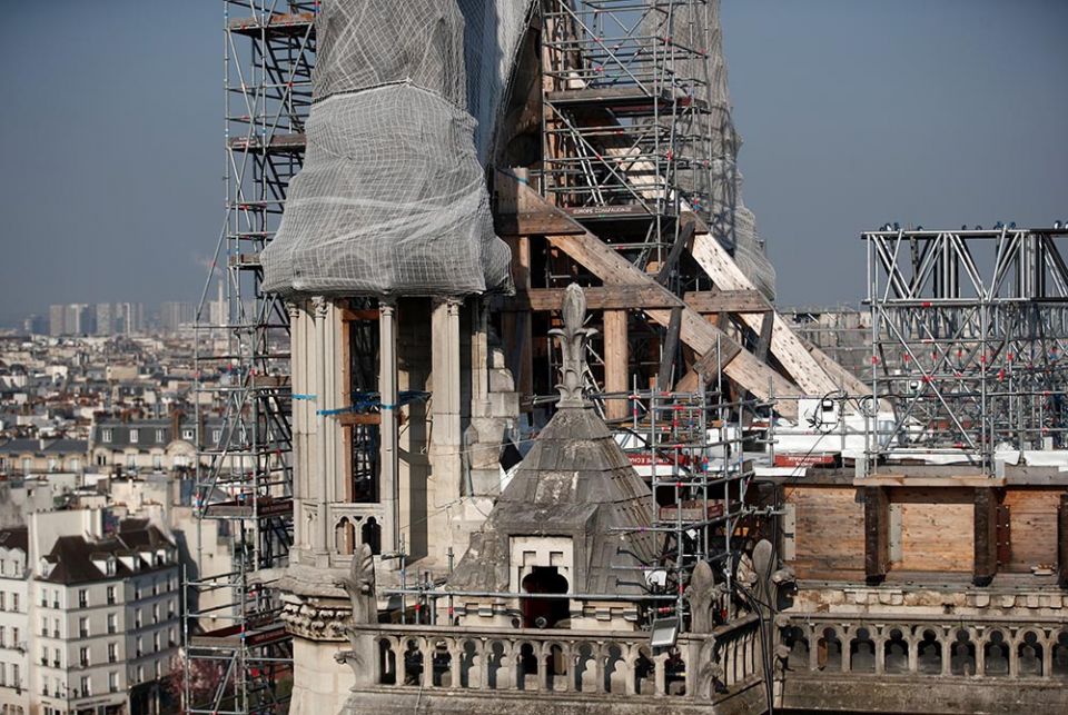 Scaffolding surrounds the damaged Notre Dame Cathedral April 15 in Paris. (CNS/Reuters/Benoit Tessier)