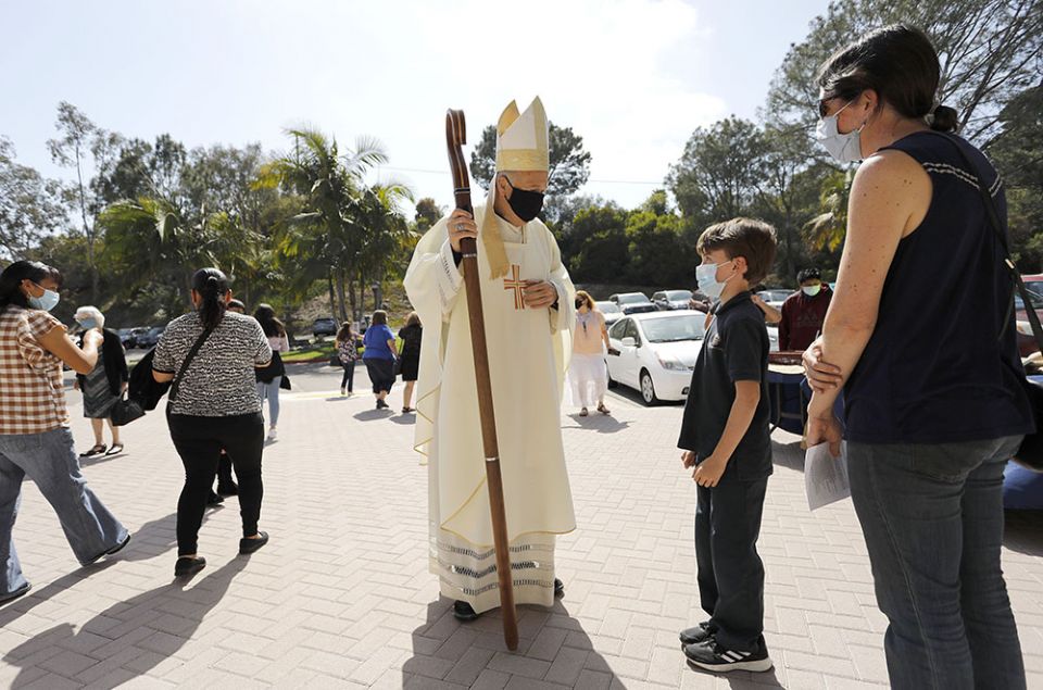 San Diego Bishop Robert McElroy greets parishioners at St. James Church in Solana Beach, California, April 17, after celebrating a bilingual Mass for Earth Week, observed April 16-25. (CNS/The Southern Cross/John Gastaldo)