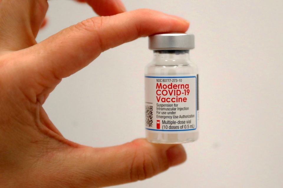 A health care worker holds a vial of the Moderna COVID-19 vaccine at a pop-up vaccination site operated by SOMOS Community Care during the COVID-19 pandemic New York in this Jan. 29 file photo. (CNS/Reuters/Mike Segar) A health care worker holds a vial of the Moderna COVID-19 vaccine at a pop-up vaccination site operated by SOMOS Community Care during the COVID-19 pandemic New York in this Jan. 29 file photo. (CNS/Reuters/Mike Segar)