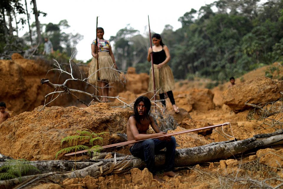 Young people from the Mura tribe are seen at a deforested area in unmarked Indigenous lands inside the Amazon rainforest near Humaita, Brazil. (CNS/Reuters/Ueslei Marcelino)