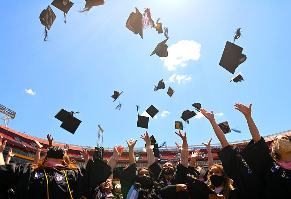Graduates of the Catholic University of America celebrate during the school's 132nd annual commencement ceremony at FedExField May 15, 2021, in Landover, Maryland. (CNS/Courtesy of the Catholic University of America)