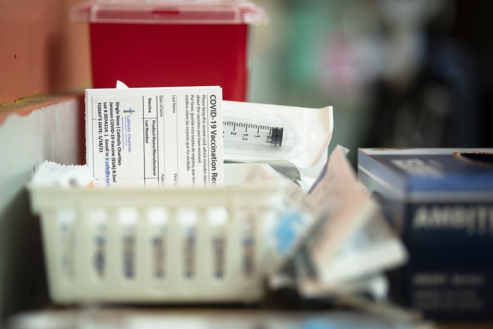 A COVID-19 vaccination card is seen at Catholic Charities in the Brookland neighborhood of Washington, D.C., May 18. (CNS/Tyler Orsburn)