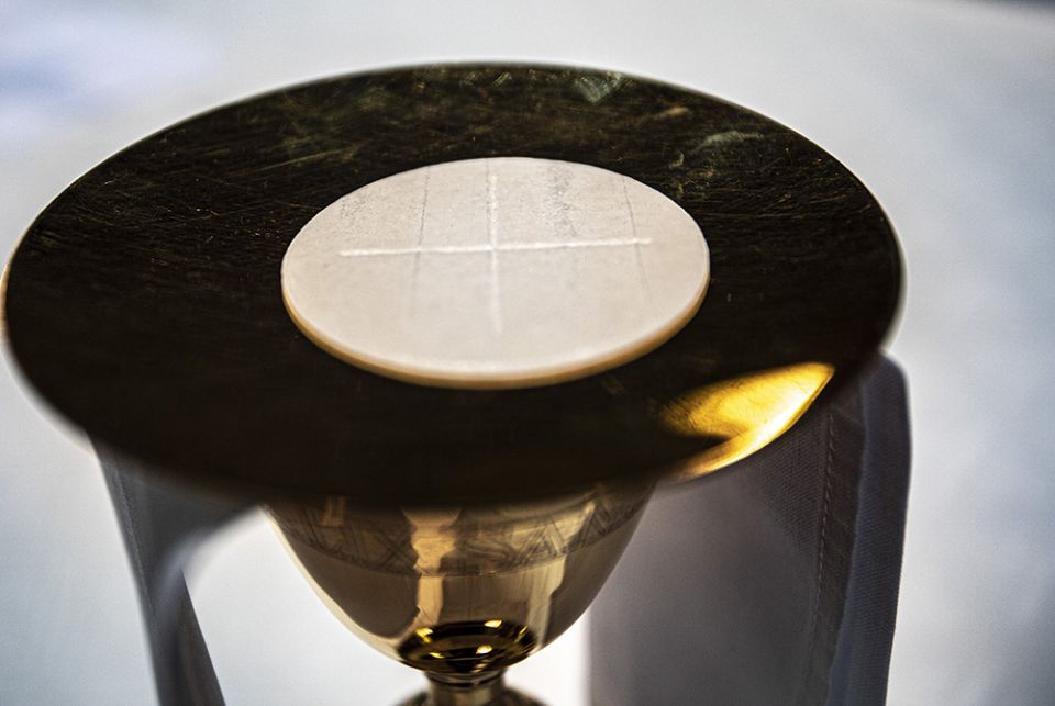 The Eucharist rests on a paten on an altar in a cathedral. (CNS/Chaz Muth) The Eucharist rests on a paten on an altar in a cathedral. (CNS/Chaz Muth)