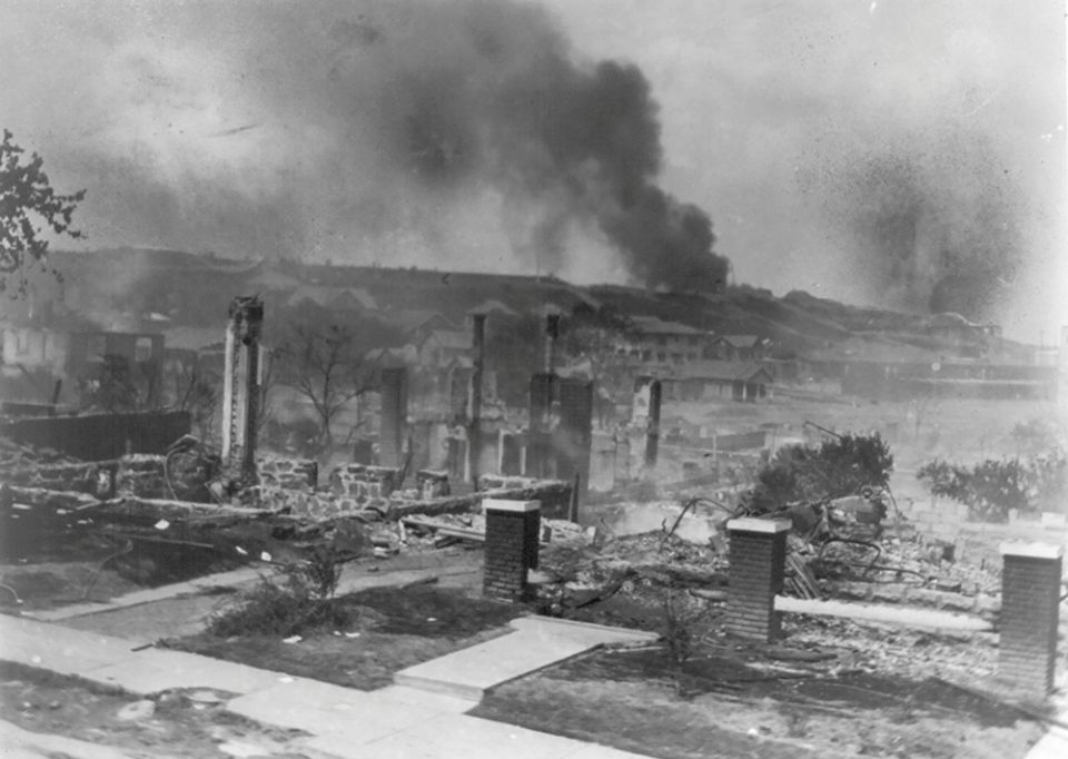 Smoke rises from the ruins of African Americans' homes following the 1921 race massacre in Tulsa, Oklahoma. (CNS/Library of Congress, Handout via Reuters/National Association for the Advancement of Colored People Records/Alvin C. Krupnick Co.) Smoke rises from the ruins of African Americans' homes following the 1921 race massacre in Tulsa, Oklahoma. (CNS/Library of Congress, Handout via Reuters/National Association for the Advancement of Colored People Records/Alvin C. Krupnick Co.)