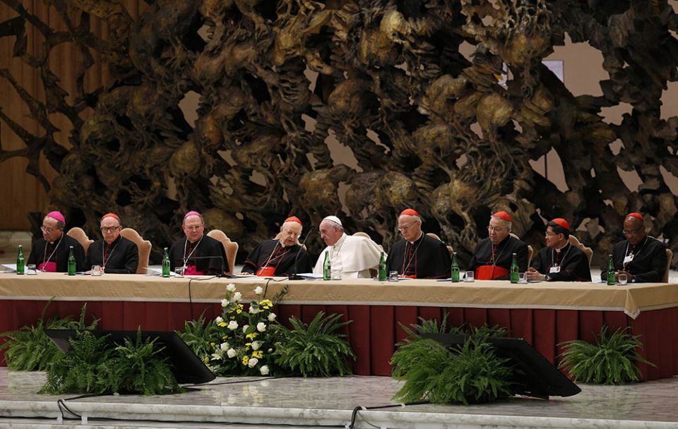 Pope Francis and leaders of the Synod of Bishops on the family and top officials from the synod's general council attend an event in Paul VI hall at the Vatican on Oct. 17, 2015, marking the 50th anniversary of the formation of the Synod of Bishops. (CNS)