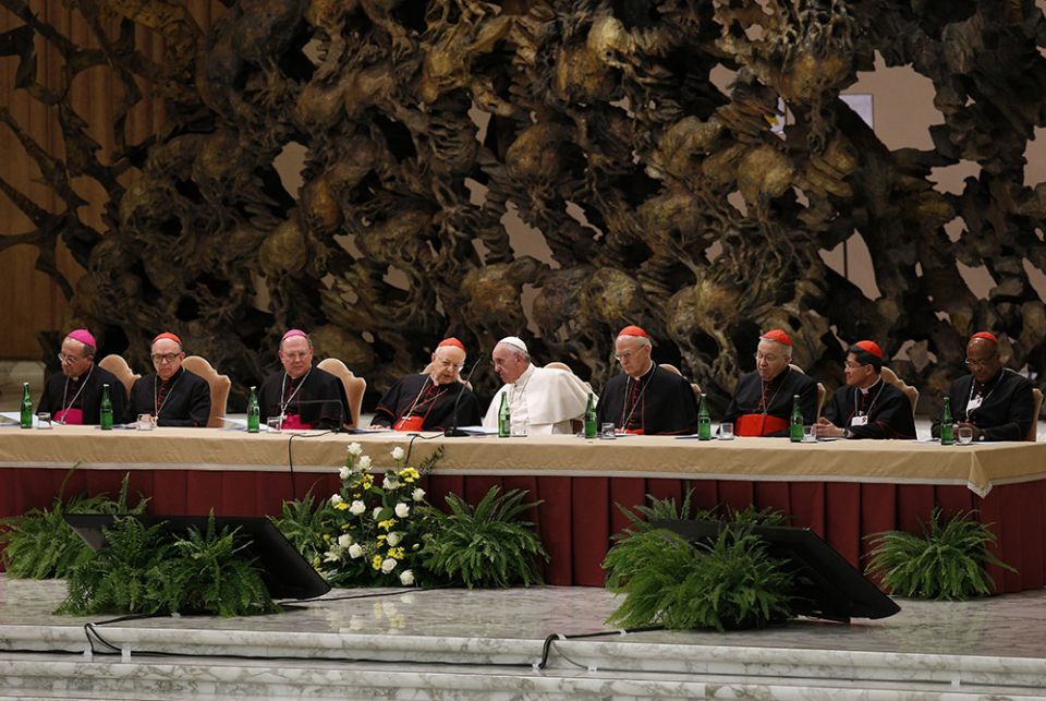 Pope Francis and leaders of the Synod of Bishops on the family and top officials from the synod's general council attend an event marking the 50th anniversary of the Synod of Bishops in Paul VI hall at the Vatican in this Oct. 17, 2015, file photo. (CNS)