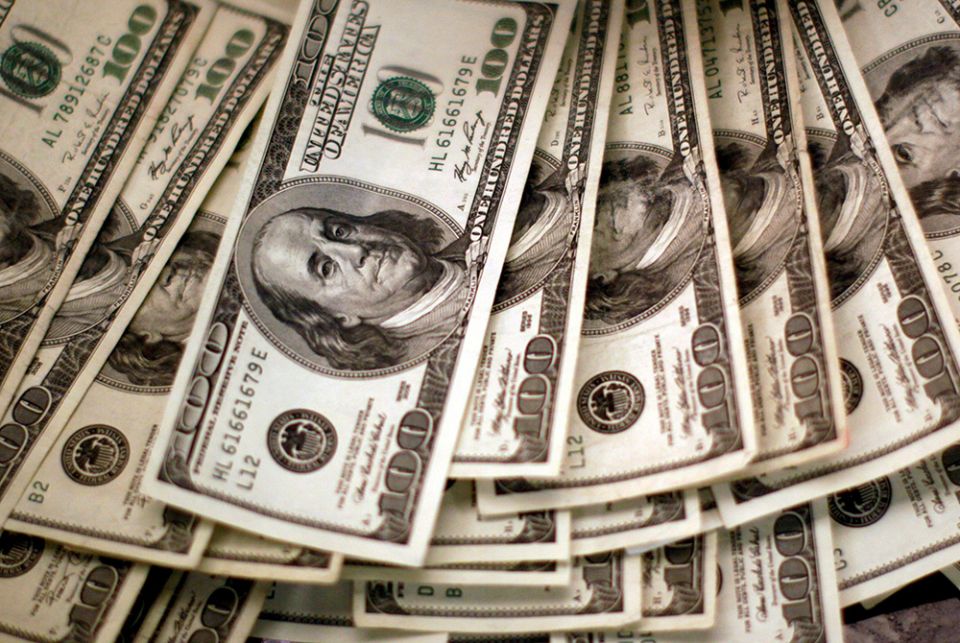 U.S. dollars are seen in this illustration photo U.S. dollars are seen in this illustration photo. (CNS/Reuters/Rick Wilking)