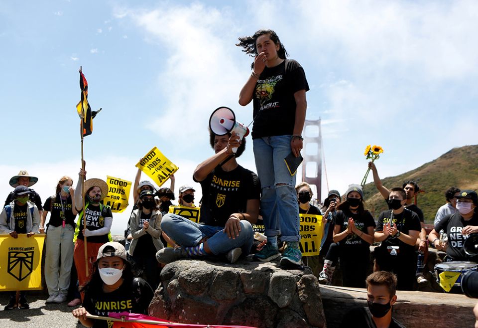 Climate activists are seen near the Golden Gate Bridge June 14, 2021, in San Francisco. (CNS/Reuters/Amy Osborne)