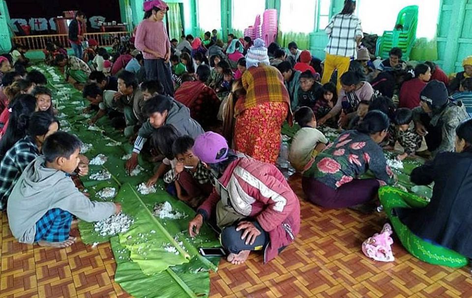 People displaced by fighting in northwestern Myanmar eat at a shelter in Chin state May 31. (CNS/Reuters) People displaced by fighting in northwestern Myanmar eat at a shelter in Chin state May 31. (CNS/Reuters)