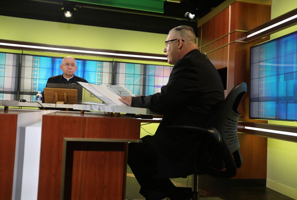 Los Angeles Archbishop José Gomez, president of the U.S. Conference of Catholic Bishops, looks on as Msgr. Jeffrey D. Burrill, the conference's general secretary, reads a message to Pope Francis June 16 at the conference headquarters in Washington. (CNS) Los Angeles Archbishop José Gomez, president of the U.S. Conference of Catholic Bishops, looks on as Msgr. Jeffrey D. Burrill, the conference's general secretary, reads a message to Pope Francis June 16 at the conference headquarters in Washington. (CNS)