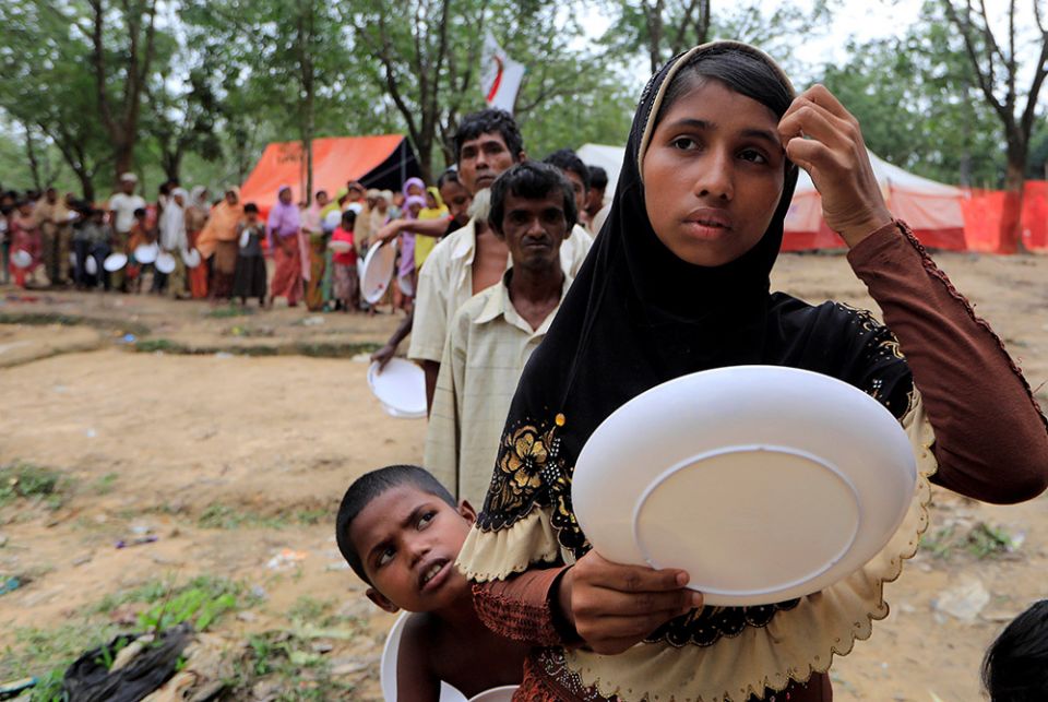 Rohingya refugees line up to get food from the Turkish Cooperation and Coordination Agency near Cox's Bazar Oct. 21, 2017, in Bangladesh. (CNS/Reuters/Zohra Bensemra) Rohingya refugees line up to get food from the Turkish Cooperation and Coordination Agency near Cox's Bazar Oct. 21, 2017, in Bangladesh. (CNS/Reuters/Zohra Bensemra)