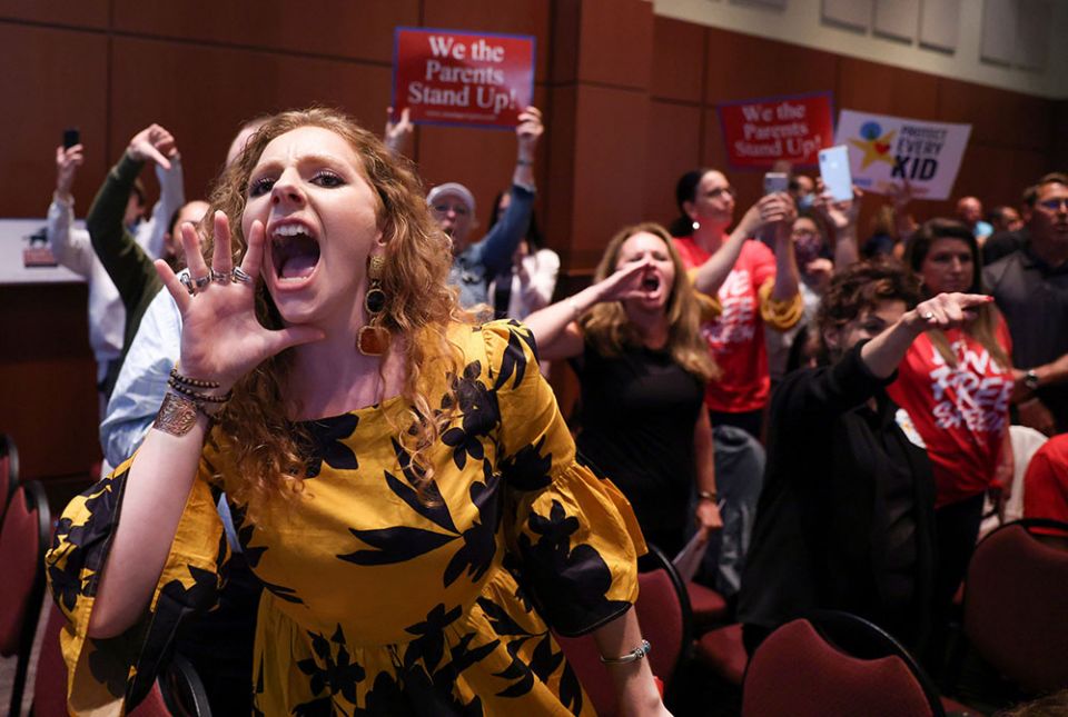 Angry parents and community members in Ashburn, Virginia, protest after the Loudoun County School Board halted its meeting because the crowd refused to quiet down June 22. Many at the meeting objected to "critical race theory" being part of the curriculum