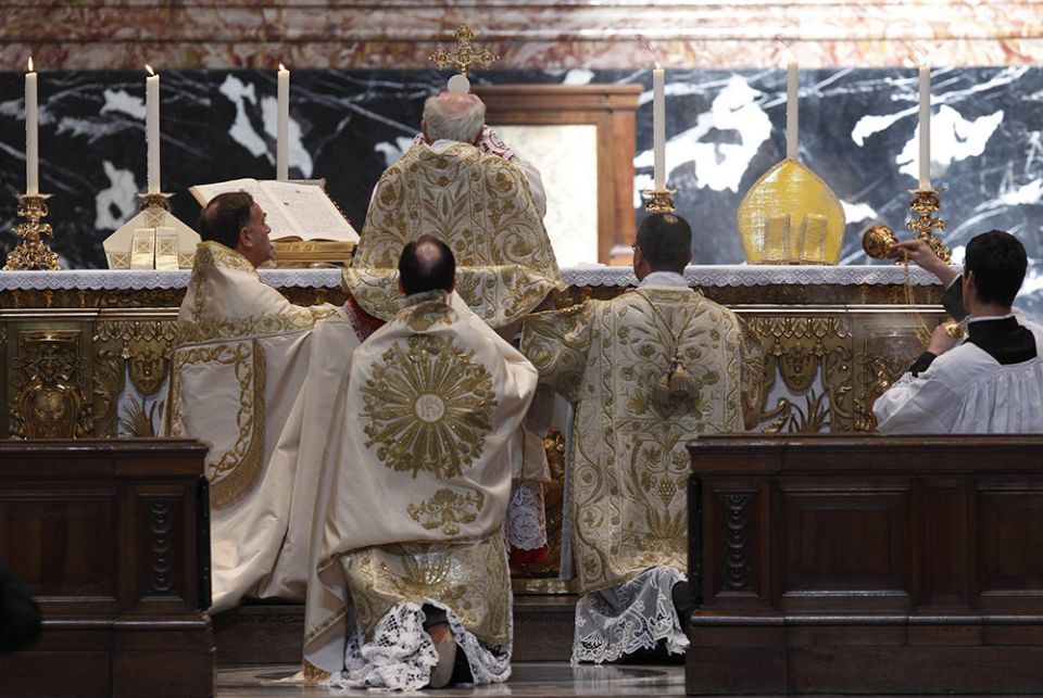 Cardinal Walter Brandmuller elevates the Eucharist during a Tridentine Mass at the Vatican in 2011 Cardinal Walter Brandmuller elevates the Eucharist during a Tridentine Mass at the Altar of the Chair in St. Peter's Basilica at the Vatican May 15, 2011. (CNS/Paul Haring)