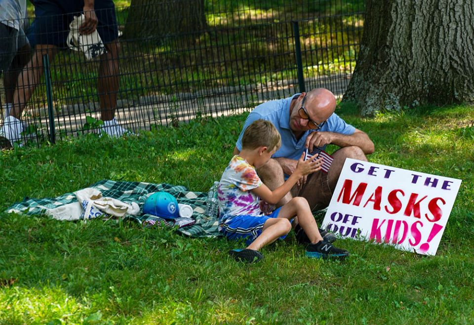 A child and an adult are seen during a demonstration against COVID-19 vaccines and restrictions July 24, 2021, in New York City. (CNS/Reuters/David Delgado) A child and an adult are seen during a demonstration against COVID-19 vaccines and restrictions July 24, 2021, in New York City. (CNS/Reuters/David Delgado)