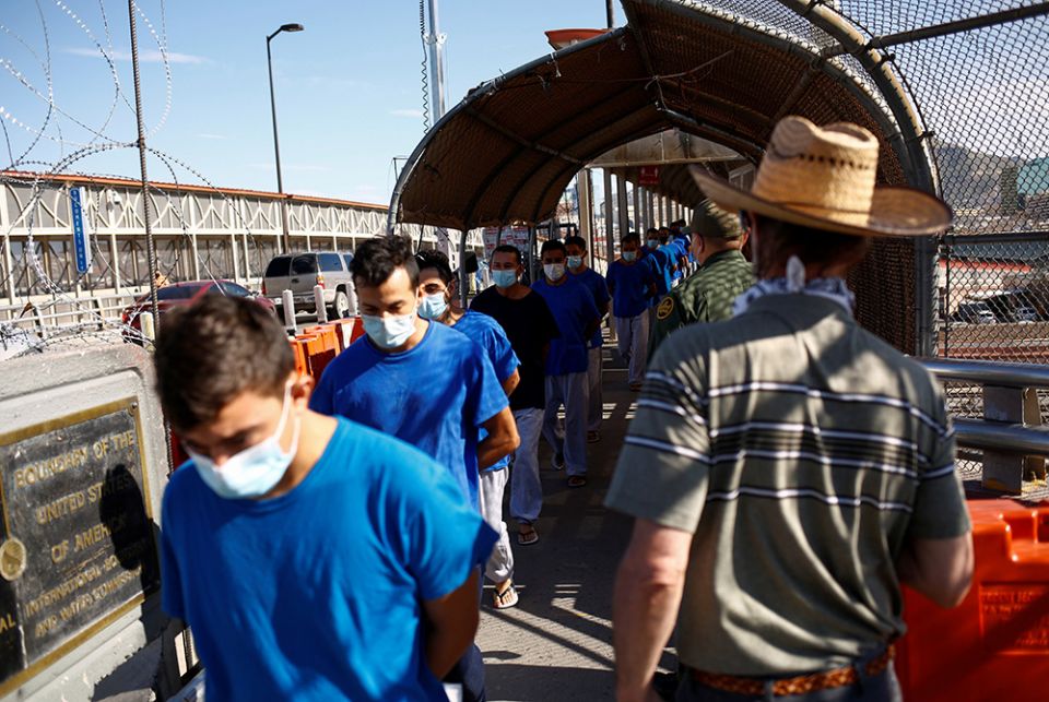 Migrants expelled from the U.S. and sent back to Mexico Migrants expelled from the U.S. and sent back to Mexico under Title 42 walk toward Mexico at the Paso del Norte International border bridge July 29, in this picture taken from Ciudad Juarez, Mexico. (CNS/Reuters/Jose Luis Gonzalez)