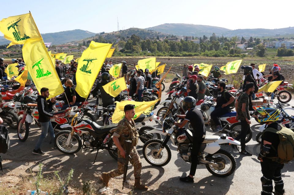 Supporters of Lebanese Hezbollah leader Sayyed Hassan Nasrallah gather in a convoy of motorcycles in the Lebanese village of Kfar Kila, near the border with Israel, May 25, 2021. Cardinal Bechara Rai, Maronite patriarch, has called for the Lebanese Armed 