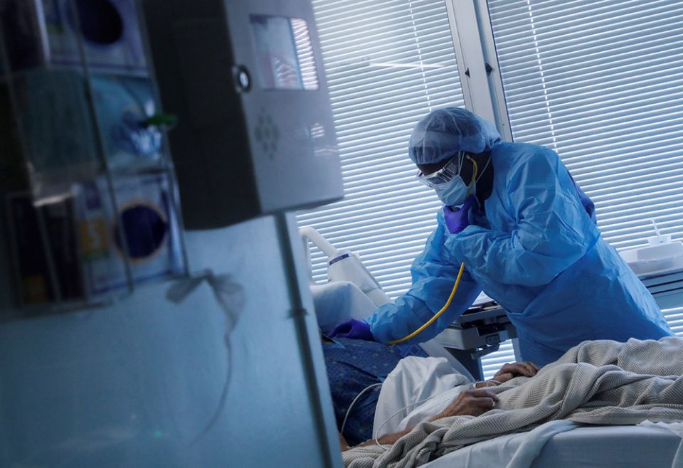 A registered nurse in Little Rock, Arkansas, checks on a COVID-19 patient Aug. 16, 2021, at the University of Arkansas for Medical Sciences. (CNS/Reuters/Shannon Stapleton) A registered nurse in Little Rock, Arkansas, checks on a COVID-19 patient Aug. 16, 2021, at the University of Arkansas for Medical Sciences. (CNS/Reuters/Shannon Stapleton)