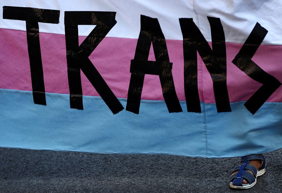 A person holds a "Trans" banner in this illustration photo. (CNS/Reuters/Sergio Perez) A person holds a "Trans" banner in this illustration photo. (CNS/Reuters/Sergio Perez)