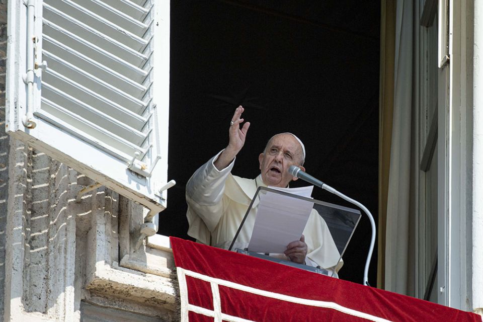 Pope Francis leads the Angelus from the window of his studio overlooking St. Peter's Square at the Vatican Aug. 22. (CNS/Vatican Media)