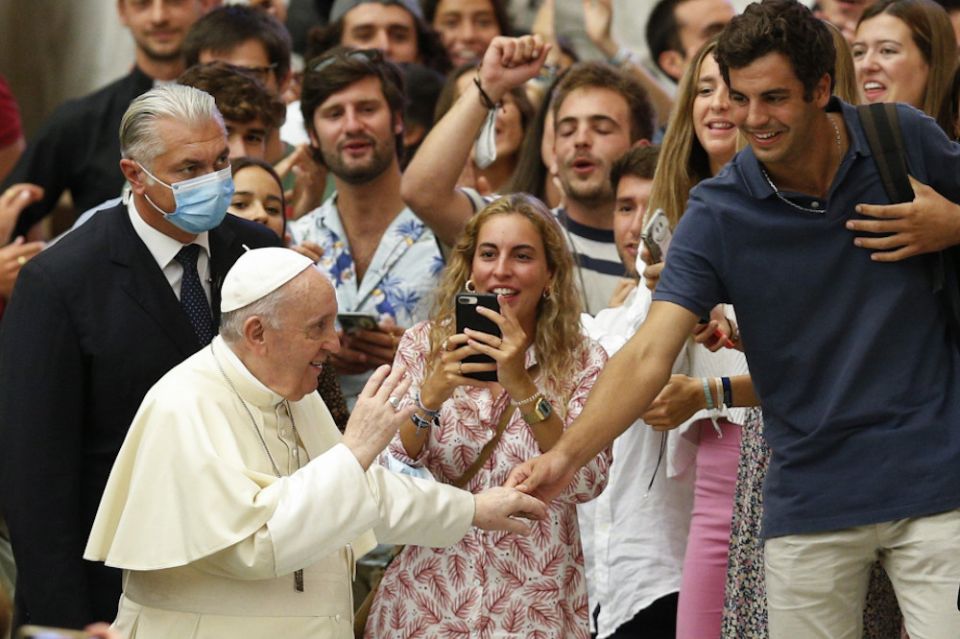 Pope Francis greets young people during his general audience in the Paul VI hall at the Vatican Sept. 1. (CNS/Paul Haring)