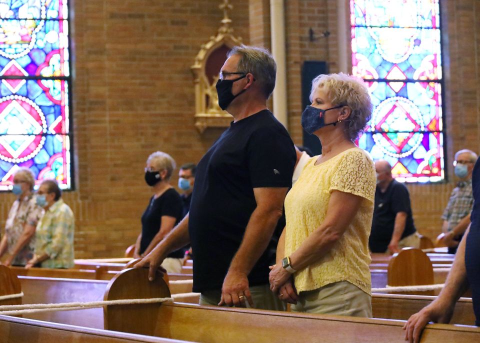 Parishioners at St. Vincent de Paul Church in Wheeling, W.Va., wear masks during Mass Aug. 28, 2021. (CNS photo/Colleen Rowan, The Catholic Spirit)