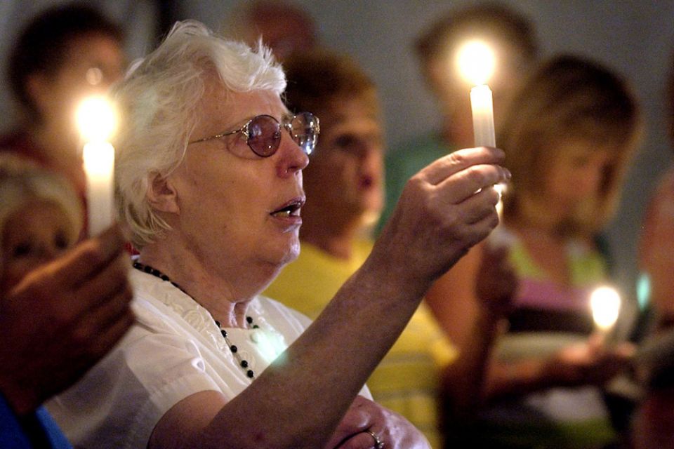 People attend a candlelight vigil at the UAL Flight 93 Memorial Chapel near Shanksville, Pennsylvania, Sept. 10, 2002. (CNS/Reuters/Tim Shaffer)