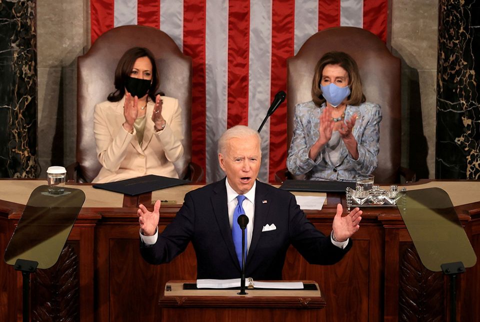 President Joe Biden addresses a joint session of Congress April 28 in Washington, as Vice President Kamala Harris and Speaker of the House U.S. Rep. Nancy Pelosi, D-Calif., applaud. (CNS/Chip Somodevilla, Pool via Reuters) President Joe Biden addresses a joint session of Congress April 28 in Washington, as Vice President Kamala Harris and Speaker of the House U.S. Rep. Nancy Pelosi, D-Calif., applaud. (CNS/Chip Somodevilla, Pool via Reuters)