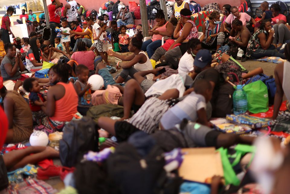 Haitian migrants trying to reach the U.S. Haitian migrants trying to reach the U.S. rest outside a shelter Sept. 24 after arriving in Monterrey, Mexico. (CNS/Reuters/Edgard Garrido)