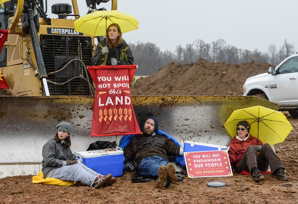 Activists with Lancaster Against Pipelines block construction of a pipeline Nov. 18, 2017, in Holtwood, Pennsylvania. (CNS/Reuters/Stephanie Keith)