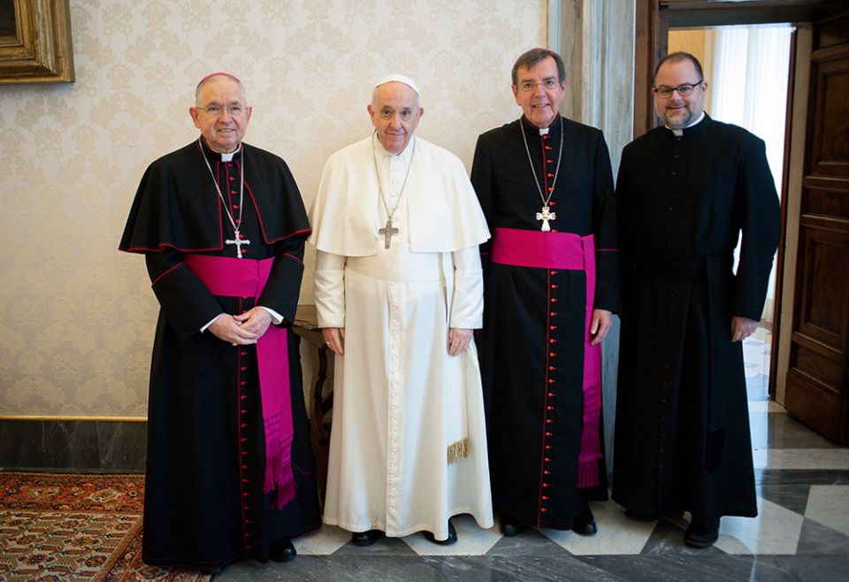 Pope Francis poses with Archbishop José Gomez, president of the U.S. bishops' conference, Archbishop Allen Vigneron, vice president, and Fr. Michael Fuller, interim general secretary, Oct. 11 at the Vatican. (CNS/Vatican Media)