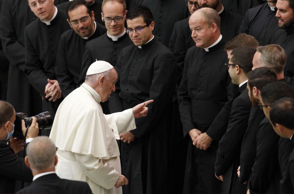 Pope Francis gestures in front of Father Peter Harman, rector of the Pontifical North American College, as he meets seminarians from the college during his general audience at the Vatican Sept. 29, 2021. (CNS photo/Paul Haring)