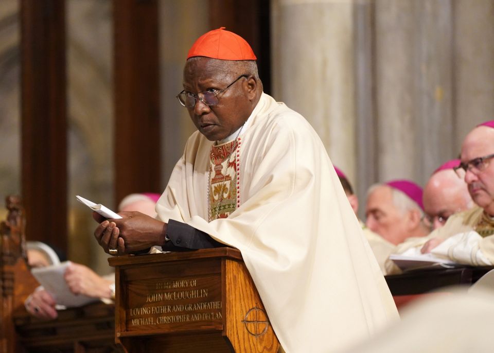 Cardinal Philippe Ouédraogo of Ouagadougou, Burkina Faso, kneels in the sanctuary at St. Patrick's Cathedral in New York City Dec. 10, 2019. (CNS photo/Gregory A. Shemitz)