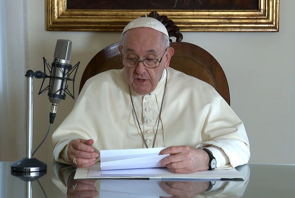 Pope Francis reads a message to listeners of BBC Radio Oct. 29, in this still image taken from video released by the Vatican. (CNS/Vatican Media)
