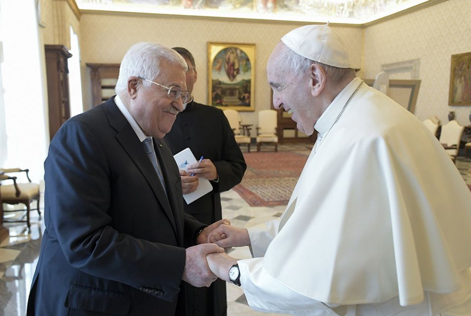 Pope Francis and Palestinian President Mahmoud Abbas exchange greetings during an audience Nov. 4 at the Vatican. (CNS/Vatican Media)