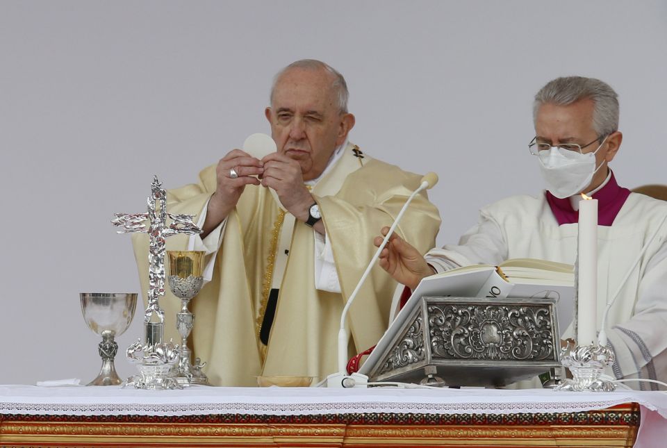 Pope Francis holds the Eucharist as he celebrates Mass at the Catholic University of the Sacred Heart in Rome Nov. 5, 2021. (CNS photo/Paul Haring)