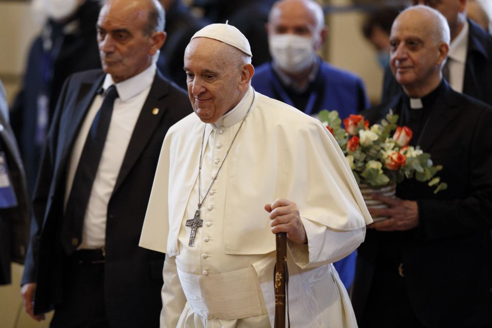 Pope Francis carries a pilgrim's staff as he arrives for a meeting with the poor at the Basilica of St. Mary of the Angels in Assisi, Italy, Nov. 12, 2021. (CNS photo/Paul Haring)