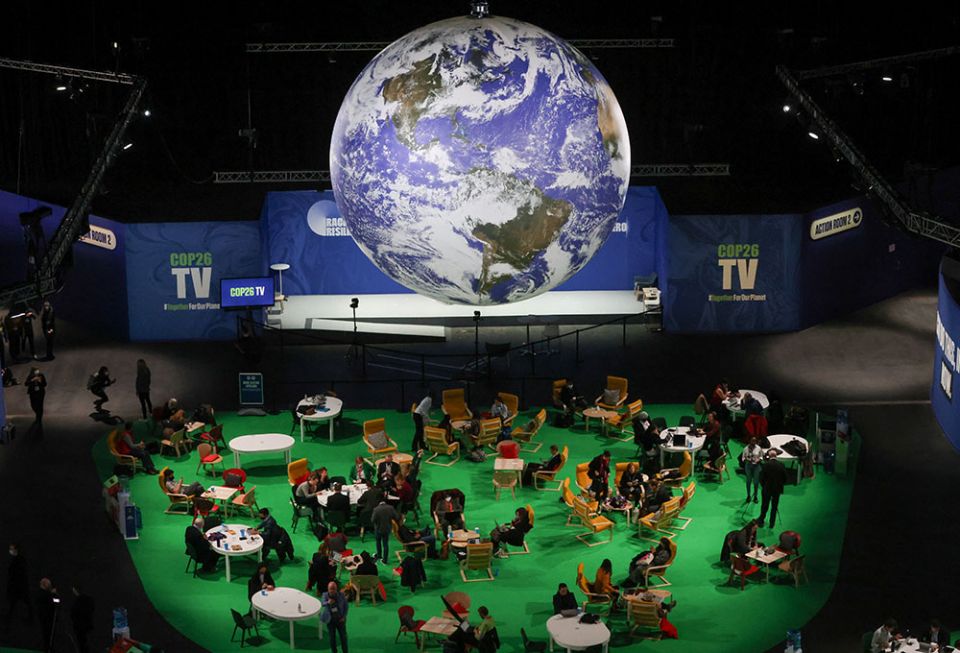 People attend the U.N. Climate Change Conference in Glasgow, Scotland, Nov. 12. (CNS/Reuters/Yves Herman)