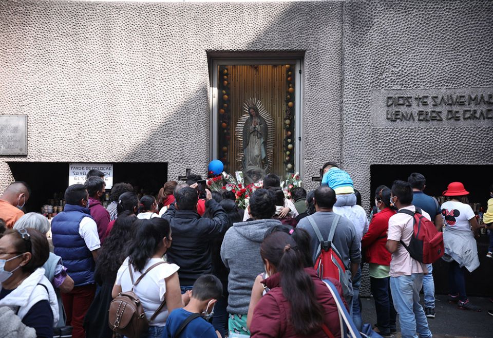 Worshipers pray near an image of Our Lady of Guadalupe outside the basilica with her name Nov. 21, 2021, in Mexico City, during the opening of the Nov. 21-28 Ecclesial Assembly of Latin America and the Caribbean. (CNS/Emilio Espejel) Worshipers pray near an image of Our Lady of Guadalupe outside the basilica with her name Nov. 21, 2021, in Mexico City, during the opening of the Nov. 21-28 Ecclesial Assembly of Latin America and the Caribbean. (CNS/Emilio Espejel)
