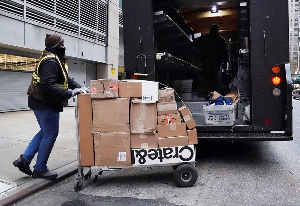 A UPS worker in New York City transports packages on Black Friday Nov. 26, 2021. (CNS/Reuters/Carlo Allegri) A UPS worker in New York City transports packages on Black Friday Nov. 26, 2021. (CNS/Reuters/Carlo Allegri)