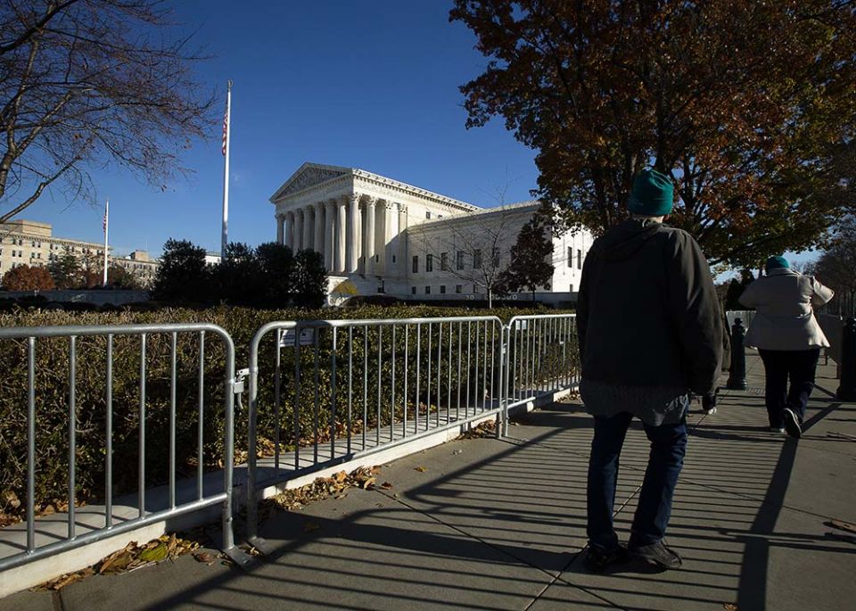 People walk past the U.S. Supreme Court in Washington Dec. 1, 2021. (CNS/Tyler Orsburn)