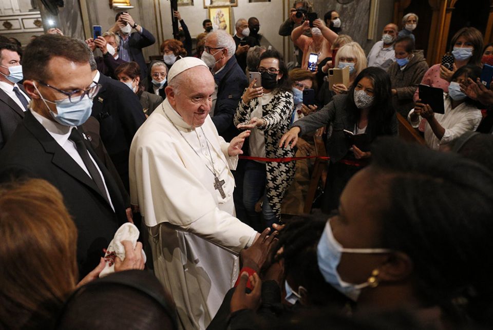 Pope Francis greets people as he leaves an ecumenical prayer with migrants in the Church of the Holy Cross Dec. 3 in Nicosia, Cyprus, Dec. 3. (CNS/Paul Haring)