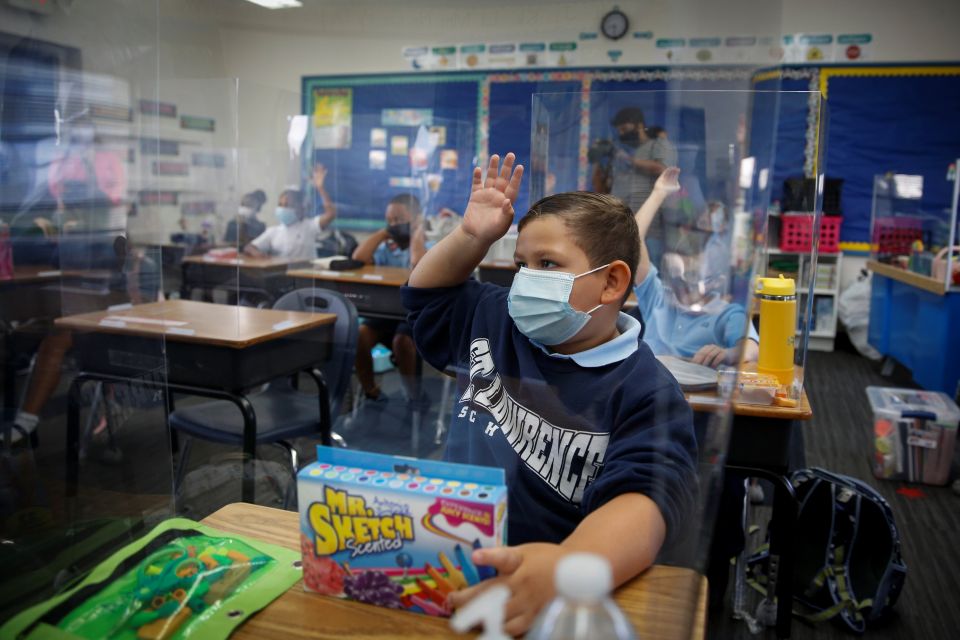 A student at St. Lawrence Catholic School in North Miami Beach, Fla., wears a protective mask on the first day of school Aug. 18, 2021, amid the coronavirus pandemic. (CNS/Reuters/Marco Bello)
