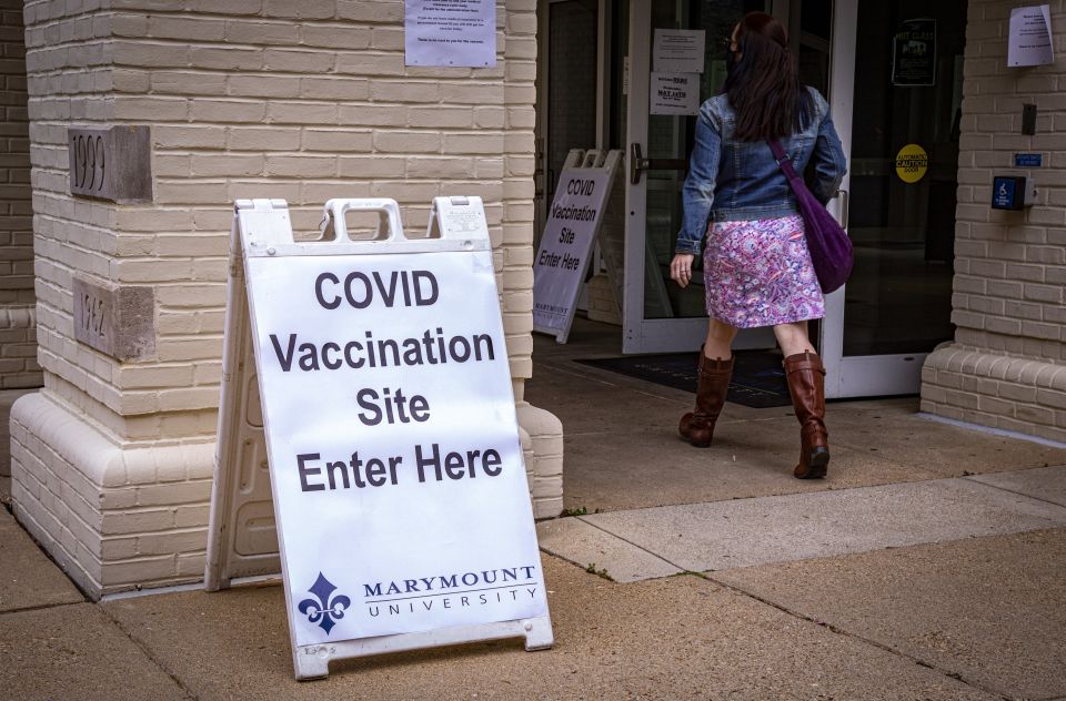 Students and faculty members at Marymount University arrive at one of the athletic buildings on the Catholic college's Arlington, Va., campus, to receive the Pfizer COVID-19 vaccine during a coronavirus vaccine clinic April 21, 2021. (CNS photo/Chaz Muth)