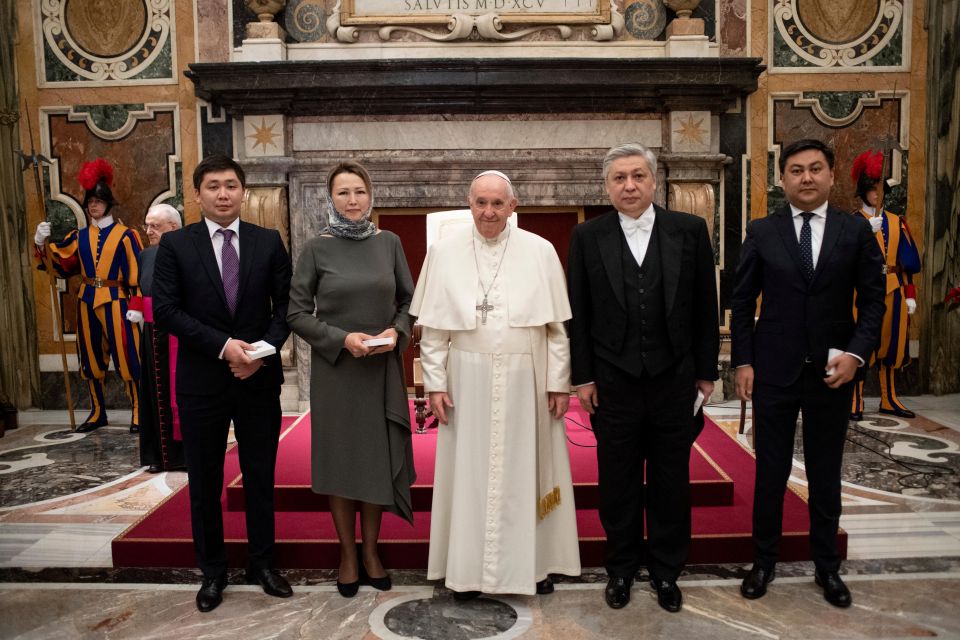 Pope Francis is pictured with new ambassadors to the Holy See during an audience with ambassadors from Moldova, Kyrgyzstan, Namibia, Lesotho, Luxembourg, Chad and Guinea-Bissau, at the Vatican Dec. 17, 2021. (CNS photo/Vatican Media)