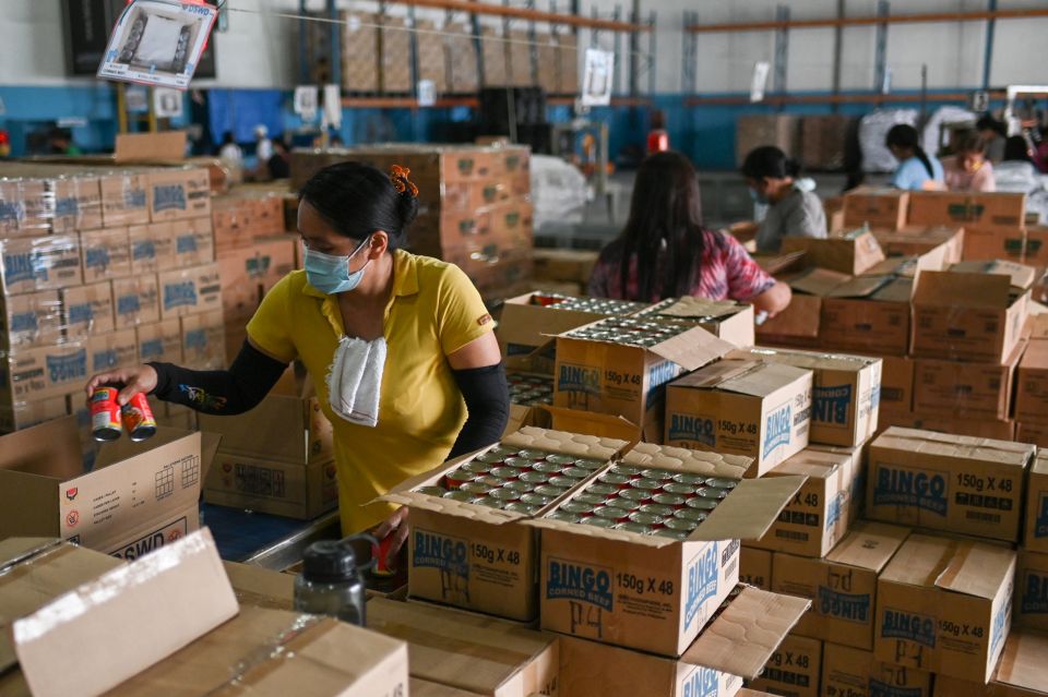 Volunteers prepare relief goods for people affected by Typhoon Rai at a government warehouse in Manila, Philippines, Dec. 17, 2021. Caritas Philippines has appealed for donations to bolster its emergency response. (CNS photo/Lisa Marie David, Reuters)