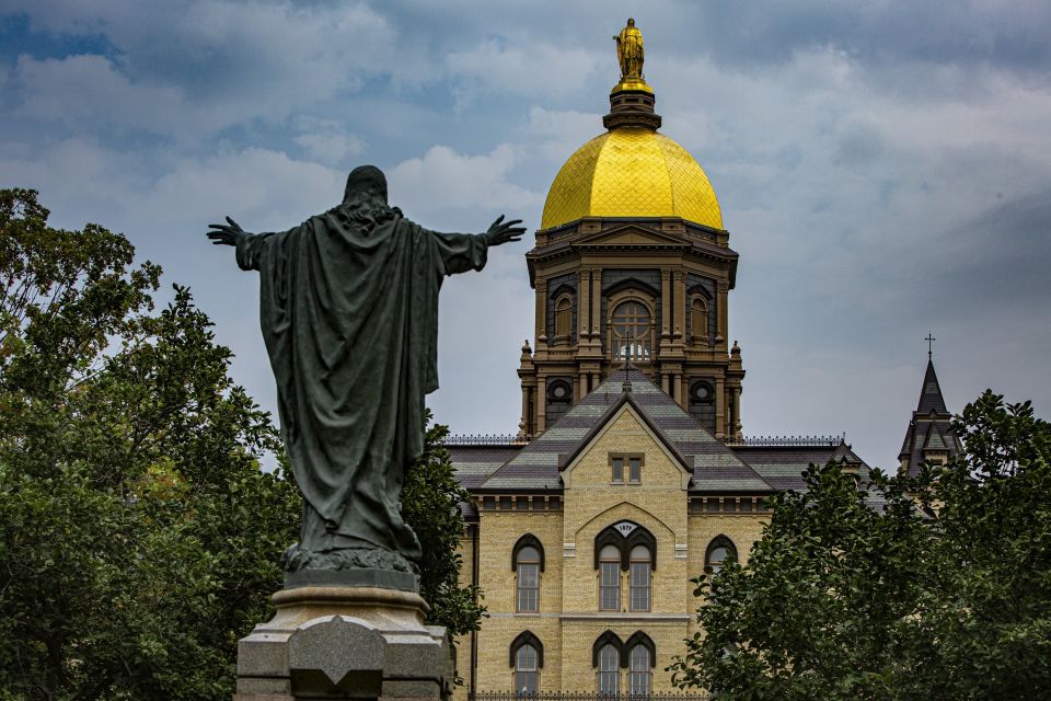 A statue of Jesus facing the Golden Dome with its statue of Mary atop the administration building of the University of Notre Dame in Notre Dame, Ind.,  Aug. 6, 2021. (CNS photo/Chaz Muth)