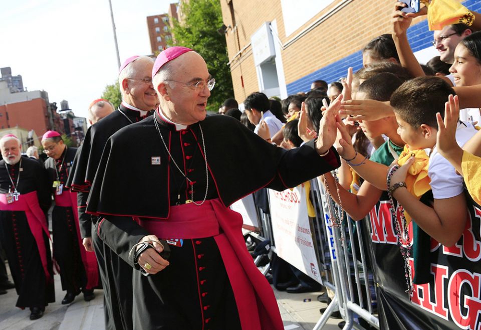 Archbishop Carlo Maria Viganò, then-apostolic nuncio to the U.S., greets children during Pope Francis' visit to Our Lady Queen of Angels School in East Harlem, New York, in this Sept. 25, 2015, file photo. (CNS/The New York Times, pool/Eric Thayer) Archbishop Carlo Maria Viganò, then-apostolic nuncio to the U.S., greets children during Pope Francis' visit to Our Lady Queen of Angels School in East Harlem, New York, in this Sept. 25, 2015, file photo. (CNS/The New York Times, pool/Eric Thayer)