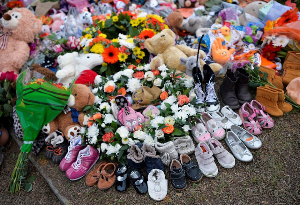 Children's shoes line a memorial on the grounds of the former Kamloops Indian Residential School June 6, 2021. (CNS/Reuters/Jennifer Gauthier)